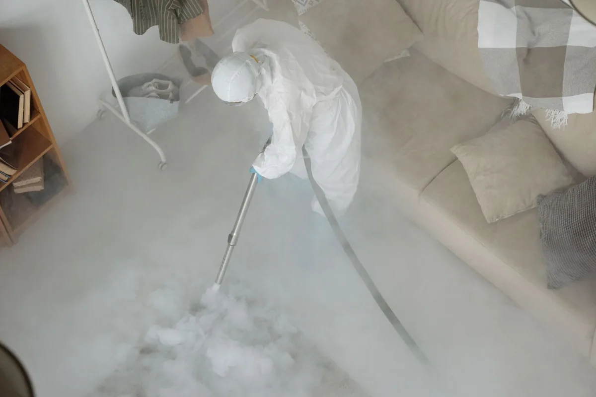 Biohazard cleanup technician in protective equipment, Sylvan Springs, AL